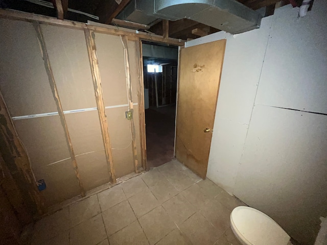 unfinished below grade area featuring tile patterned floors