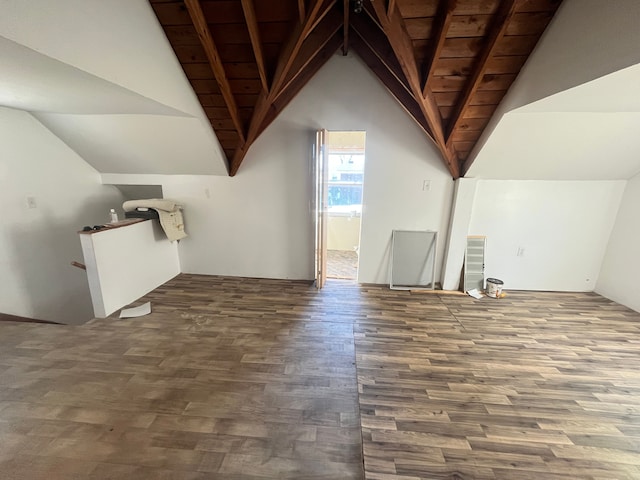 bonus room featuring wood finished floors and vaulted ceiling