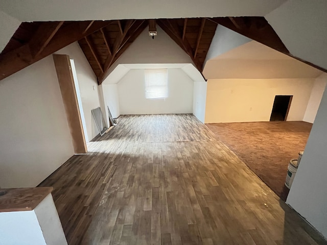 bonus room with vaulted ceiling with beams and wood finished floors
