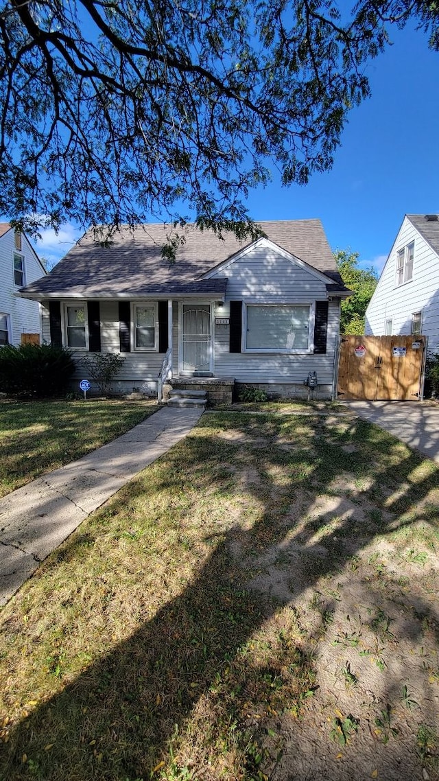 ranch-style house with a front lawn