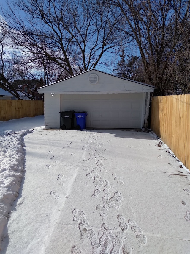 view of snow covered garage