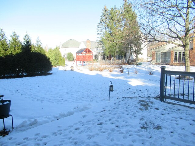 view of yard covered in snow