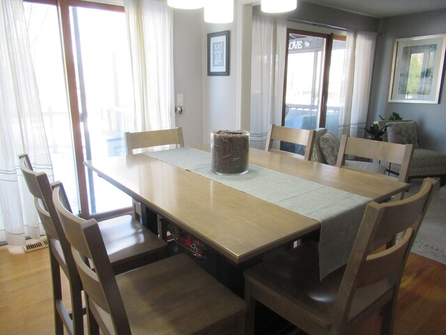 dining area with hardwood / wood-style flooring