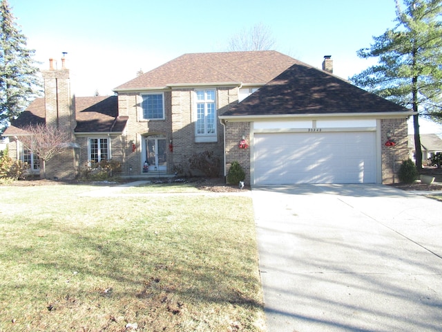 front facade with a garage and a front yard