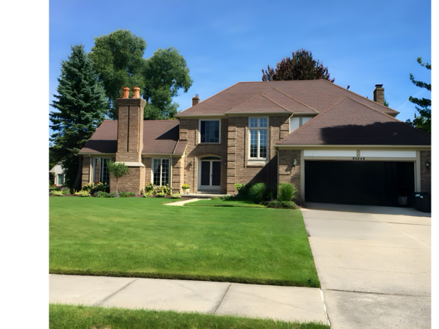 view of front of property with a garage and a front yard