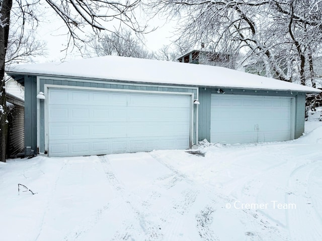 view of snow covered garage