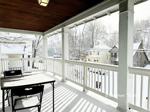 view of snow covered deck