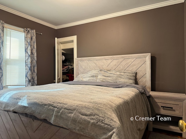 bedroom featuring ornamental molding and a closet