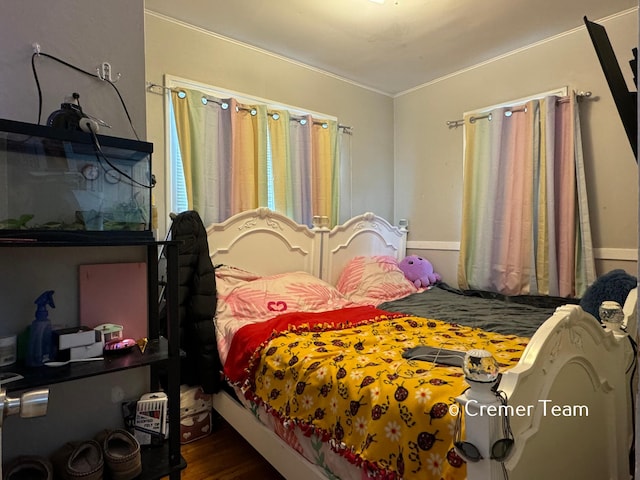 bedroom with hardwood / wood-style flooring