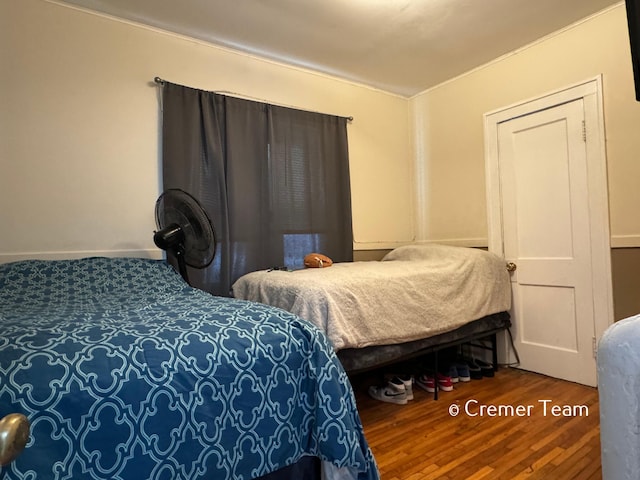 bedroom with wood-type flooring