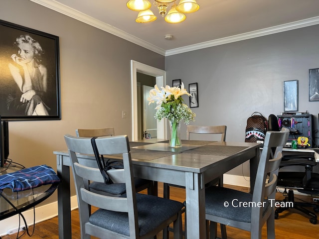 dining room with a notable chandelier, crown molding, and wood-type flooring