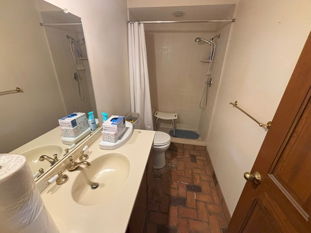 bathroom featuring vanity, toilet, and a shower with shower curtain