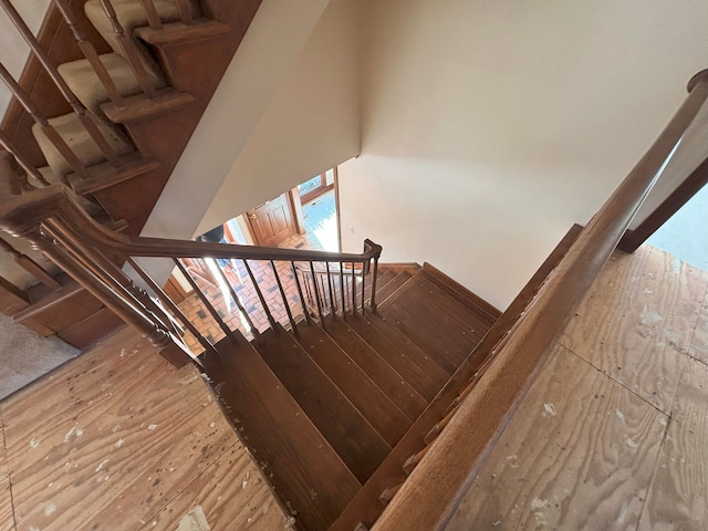 stairs with wood-type flooring