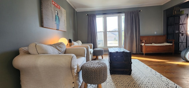 sitting room featuring crown molding and hardwood / wood-style floors