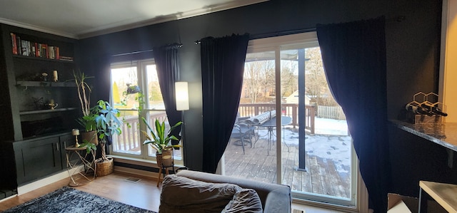 interior space with crown molding and hardwood / wood-style flooring