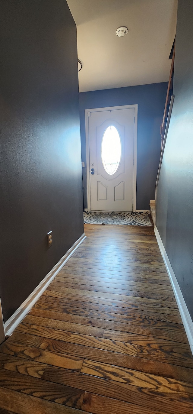 doorway with dark hardwood / wood-style flooring