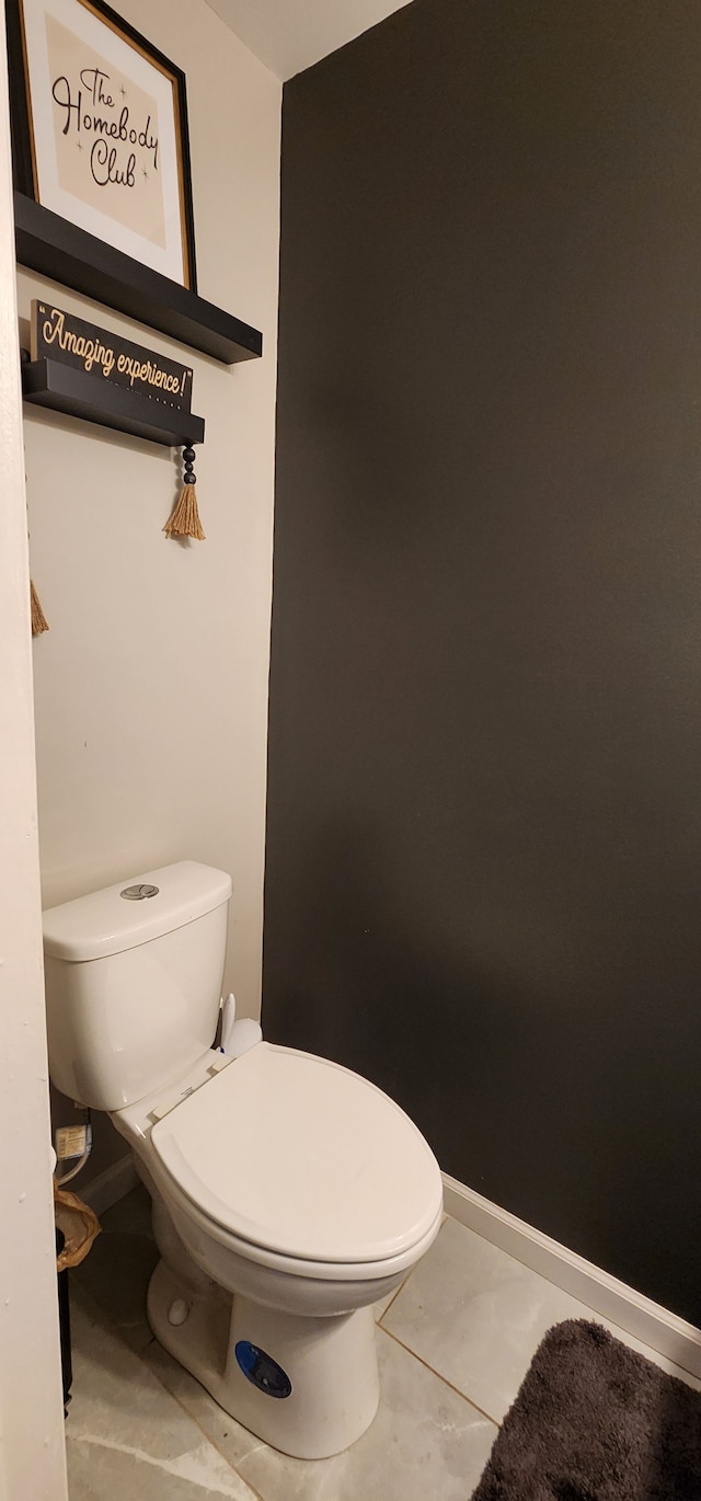 bathroom featuring tile patterned flooring and toilet