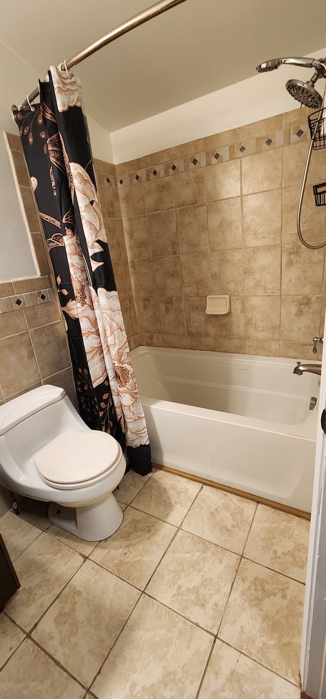 bathroom with tile patterned flooring, shower / tub combo, and toilet