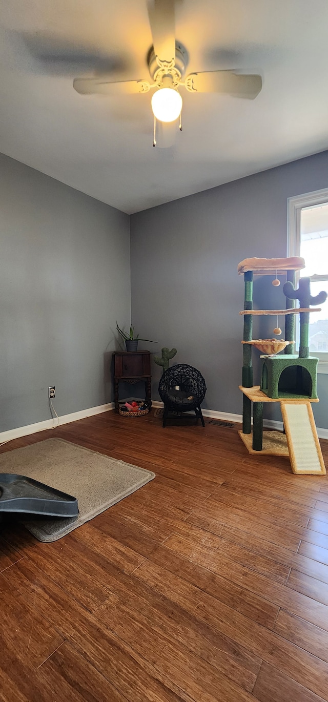 interior space featuring hardwood / wood-style flooring and ceiling fan