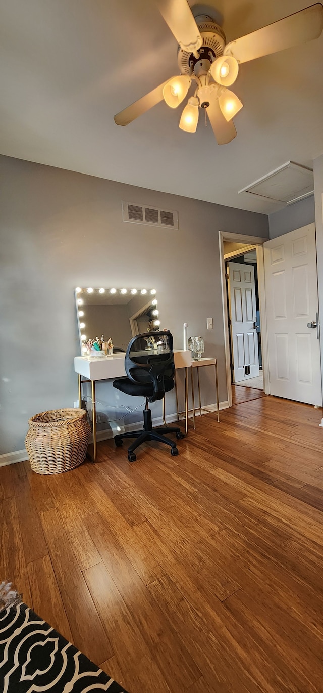 office space featuring wood-type flooring and ceiling fan