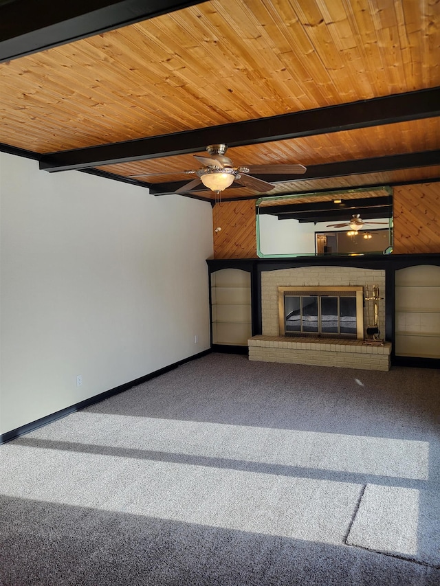 unfurnished living room featuring beam ceiling, wooden ceiling, and carpet flooring