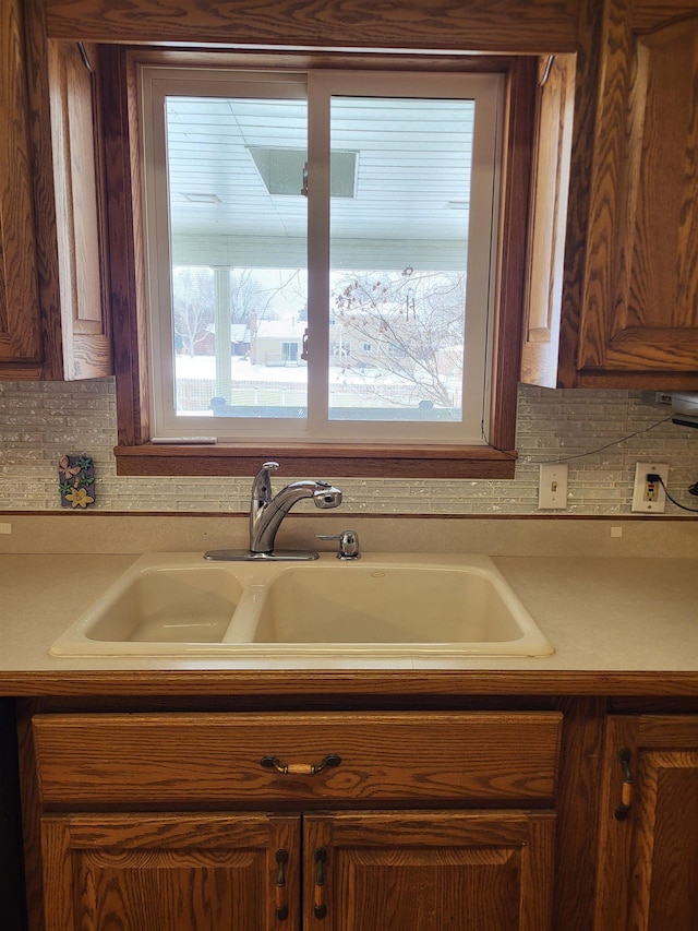 kitchen featuring sink and decorative backsplash