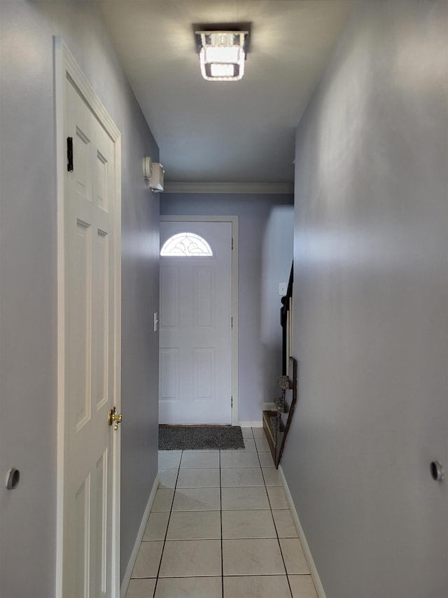 doorway with light tile patterned flooring