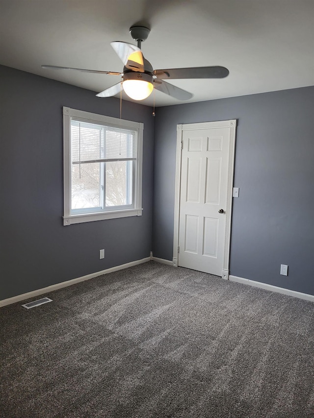 unfurnished bedroom with carpet and ceiling fan