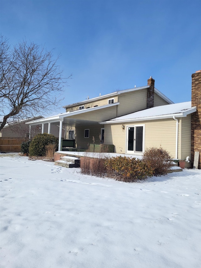 view of snow covered house