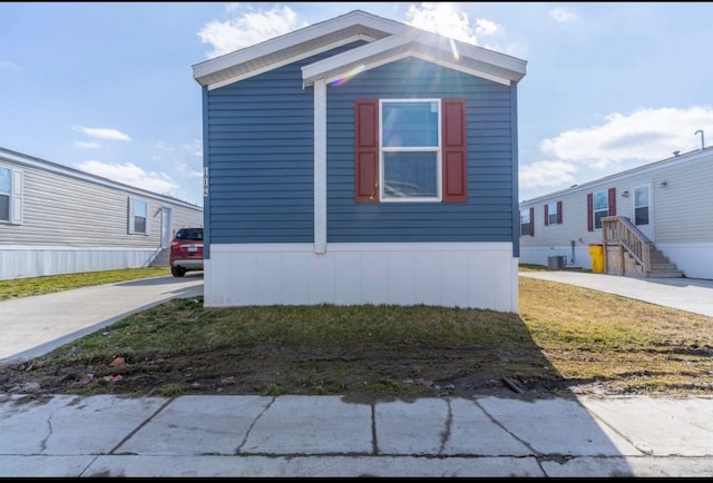 view of home's exterior featuring central AC unit