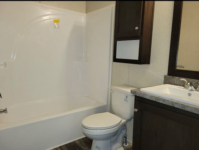 full bathroom with hardwood / wood-style flooring, vanity, toilet, and bathing tub / shower combination