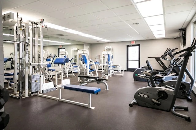 workout area featuring a drop ceiling