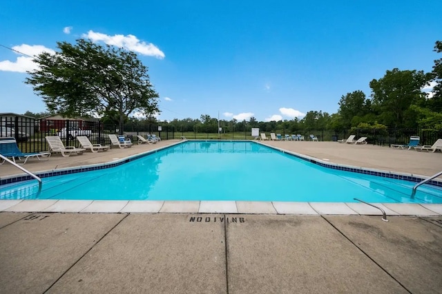 view of pool featuring a patio