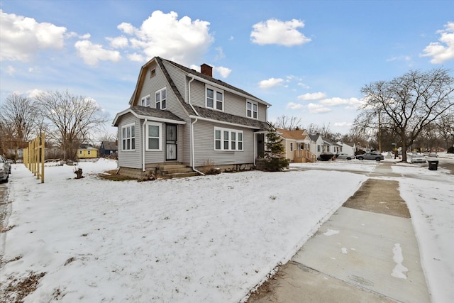 view of snow covered house