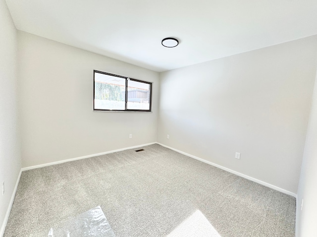 spare room featuring carpet flooring