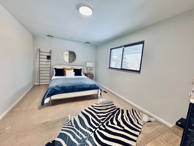 bedroom featuring light carpet