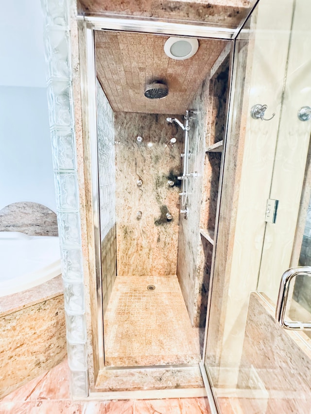 bathroom featuring an enclosed shower