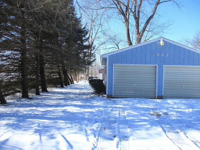 view of snow covered garage