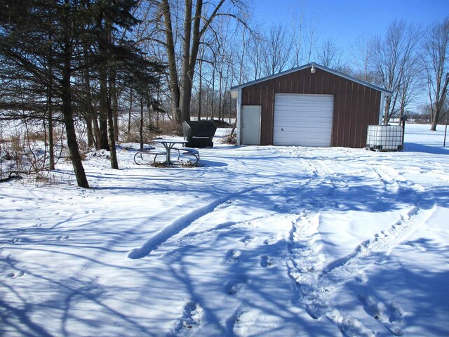 view of snow covered garage