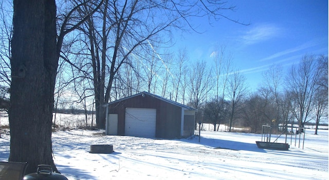 view of snow covered garage