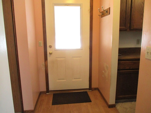 doorway to outside with light hardwood / wood-style flooring