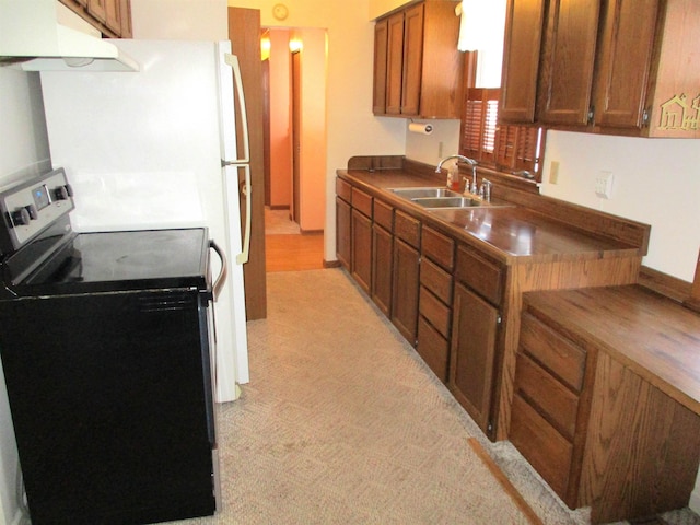 kitchen featuring sink and electric range