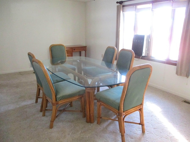 view of carpeted dining space