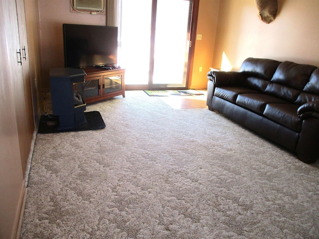 living room featuring carpet floors and a wall mounted AC