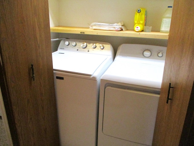 laundry room with independent washer and dryer