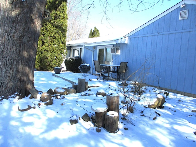 view of yard layered in snow