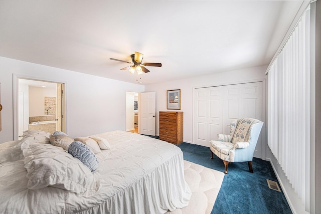 bedroom featuring ceiling fan, ensuite bath, a closet, and dark colored carpet