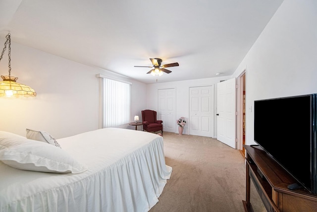 bedroom with ceiling fan and carpet