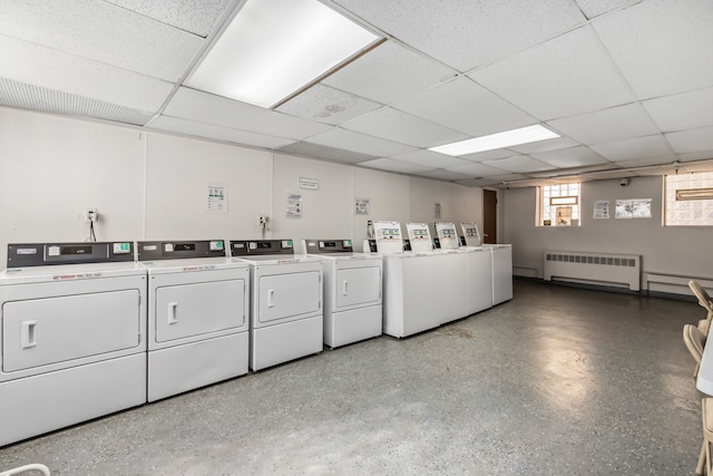 laundry area featuring washing machine and dryer and radiator