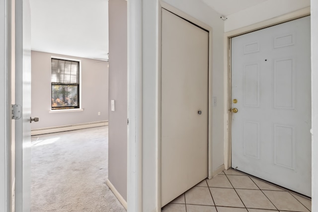 hall featuring light carpet and a baseboard heating unit